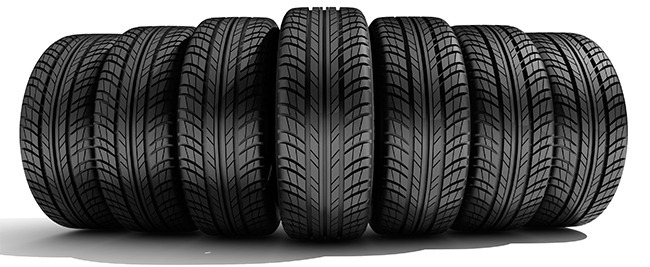 7 tyres in a row all with a diagonal tyre tread pattern