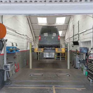 Car elvated on the vehicle lift for an MOT test at Motorvation Northampton.