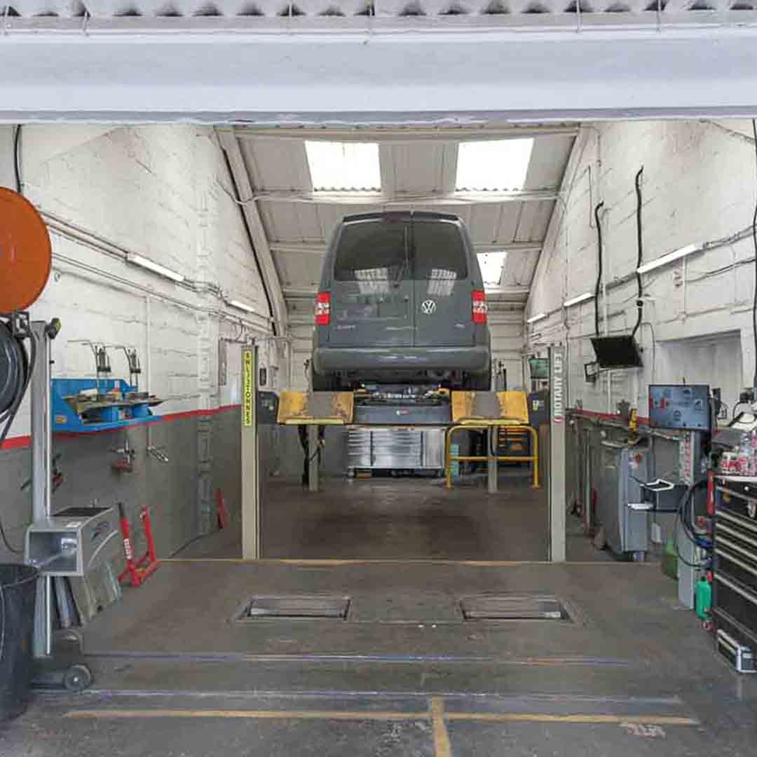 Car elvated on the vehicle lift for an MOT test at Motorvation Northampton.