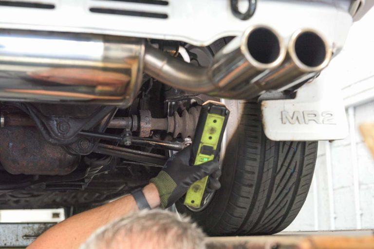 Motorvation Northampton technician inspecting a car exhaust.